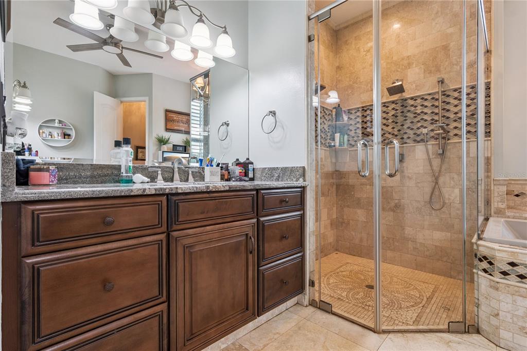 345 Cypress Isles Road Osteen, FL 32764 - Photo 15 of 41 a bathroom with a shower sink and mirror