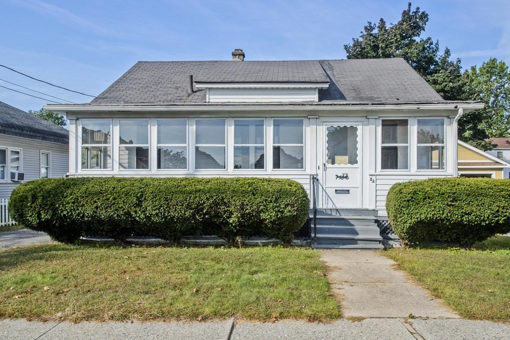 front view of a house with a yard