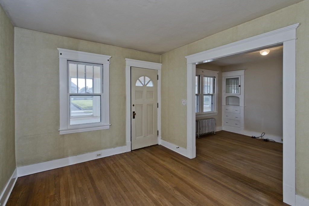 82 Redlands Street Springfield, MA 01104 - Photo 12 of 39 a view of an empty room with closet and a window