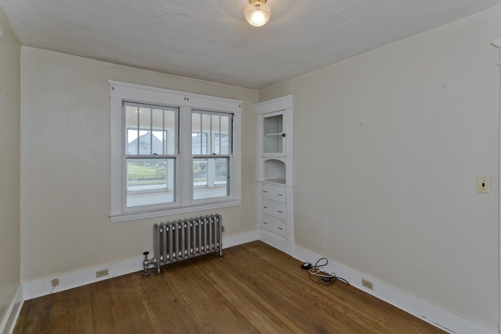 82 Redlands Street Springfield, MA 01104 - Photo 15 of 39 an empty room with windows