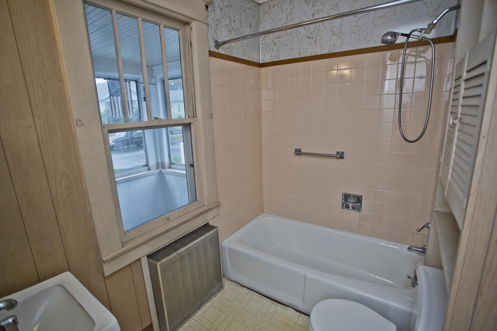 82 Redlands Street Springfield, MA 01104 - Photo 28 of 39 a bathroom with a granite countertop shower and a sink
