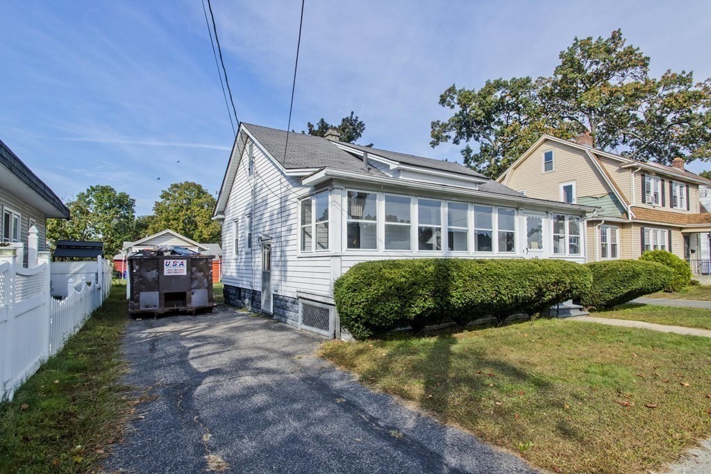 82 Redlands Street Springfield, MA 01104 - Photo 4 of 39 a front view of a house with yard and green space