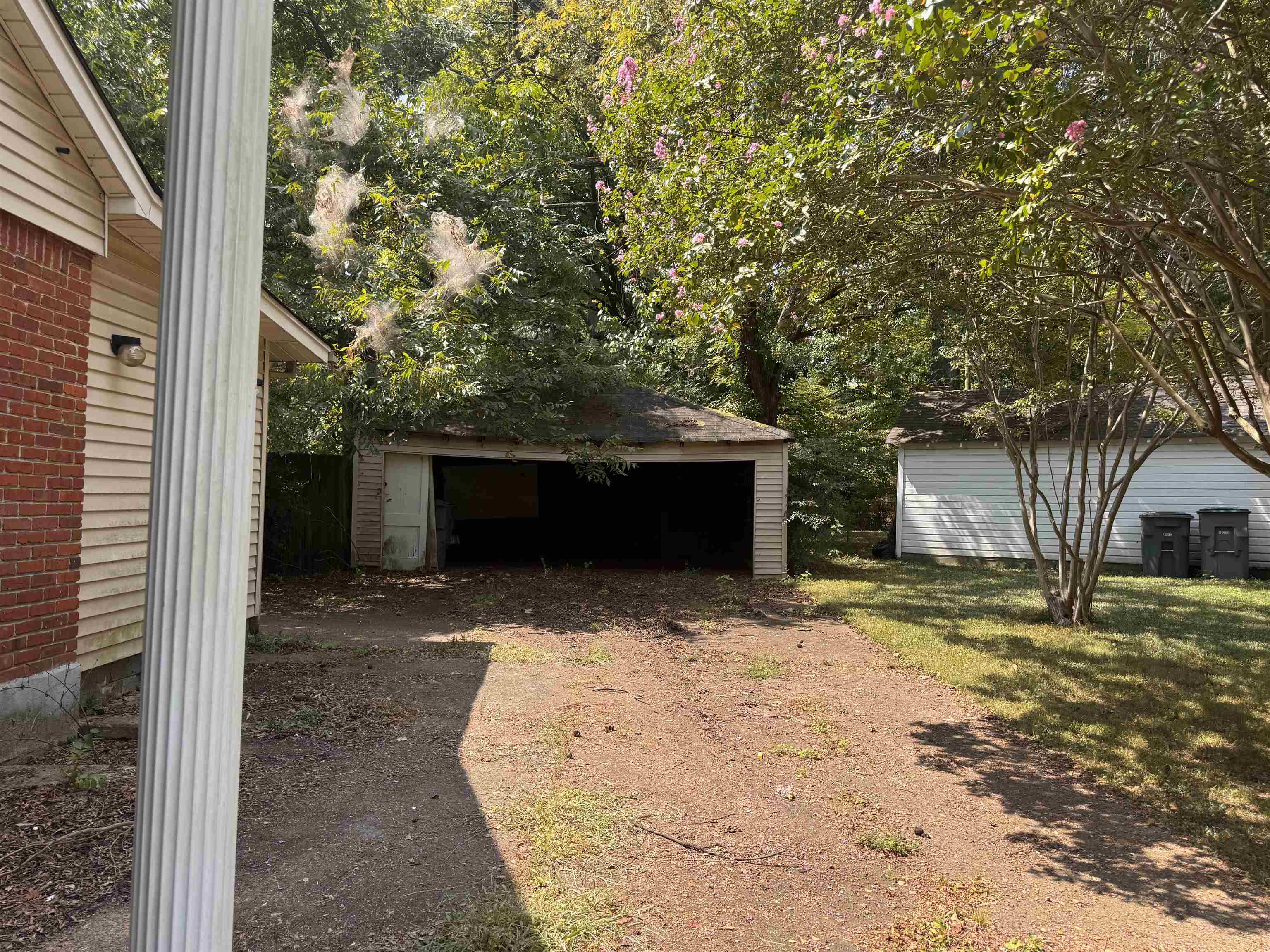 1209 Vaughn Road Memphis, TN 38122 - Photo 4 of 14 a view of a house with a yard and garage
