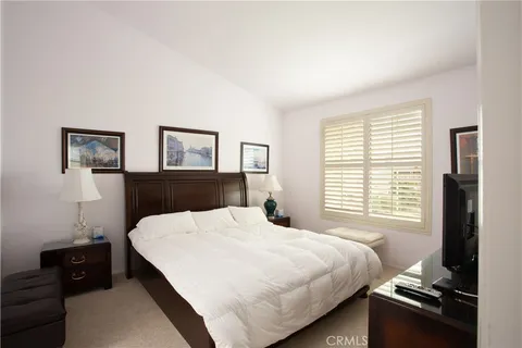 a large bathroom with a large mirror vanity and shower