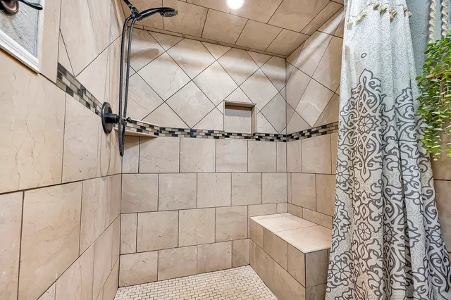 a bathroom with a sink and a shower