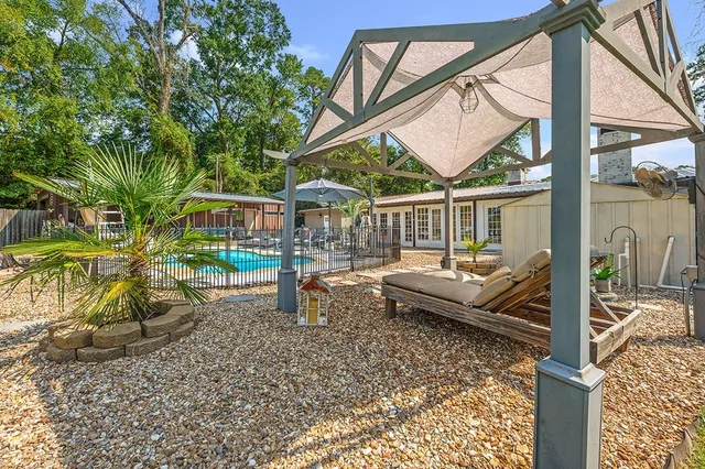 a view of house with a large window and wooden floor