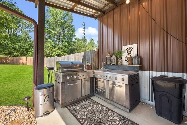 a kitchen with a stove top oven sink and cabinets