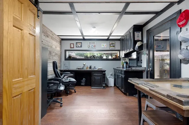 a view of a workspace with furniture