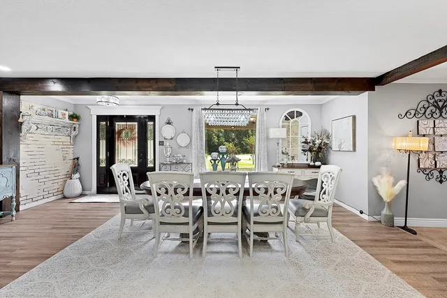 a dining room with furniture and window
