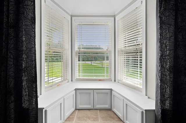 a bathroom with a bathtub and a window