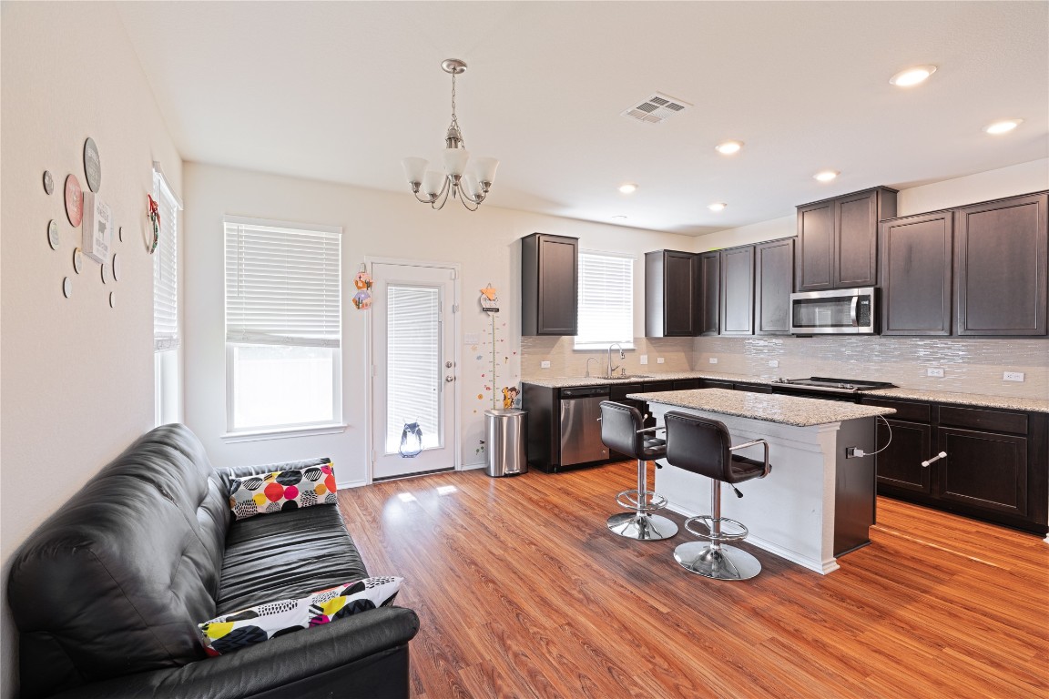2950 East Old Settlers Boulevard, Unit 3 Round Rock, TX 78665 - Photo 13 of 28 a living room with kitchen furniture and kitchen view