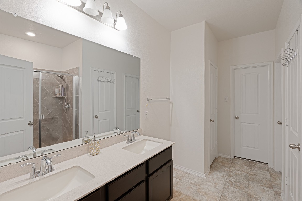 2950 East Old Settlers Boulevard, Unit 3 Round Rock, TX 78665 - Photo 14 of 28 a bathroom with a double vanity sink mirror and double
