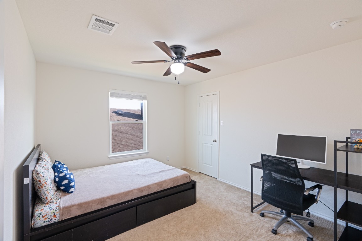 2950 East Old Settlers Boulevard, Unit 3 Round Rock, TX 78665 - Photo 19 of 28 a bedroom with a bed and a window