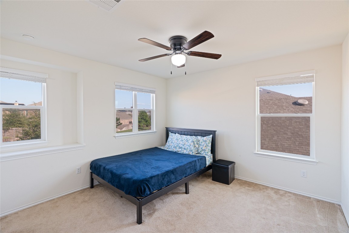2950 East Old Settlers Boulevard, Unit 3 Round Rock, TX 78665 - Photo 21 of 28 a bedroom with a bed and window