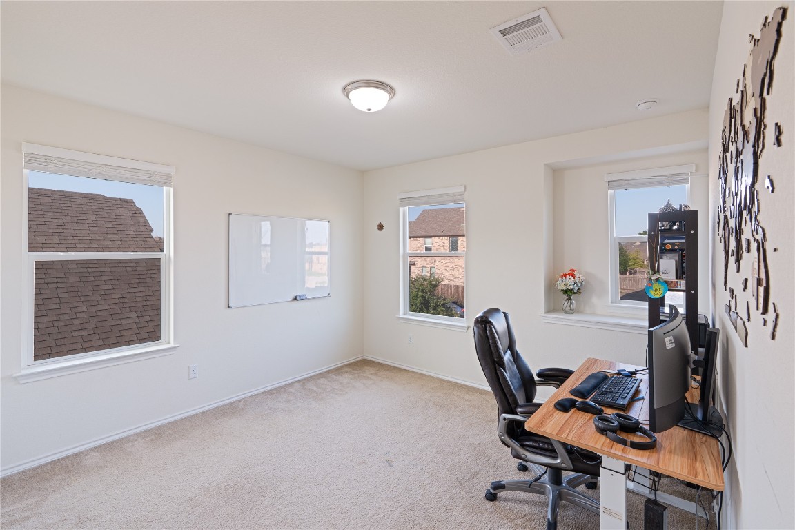 2950 East Old Settlers Boulevard, Unit 3 Round Rock, TX 78665 - Photo 23 of 28 a view of workspace with wooden floor windows