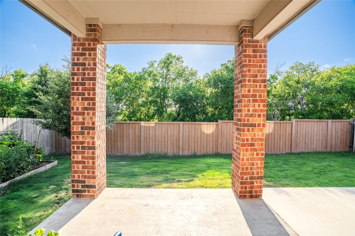 2950 East Old Settlers Boulevard, Unit 3 Round Rock, TX 78665 - Photo 28 of 28 a view of a backyard with a garden