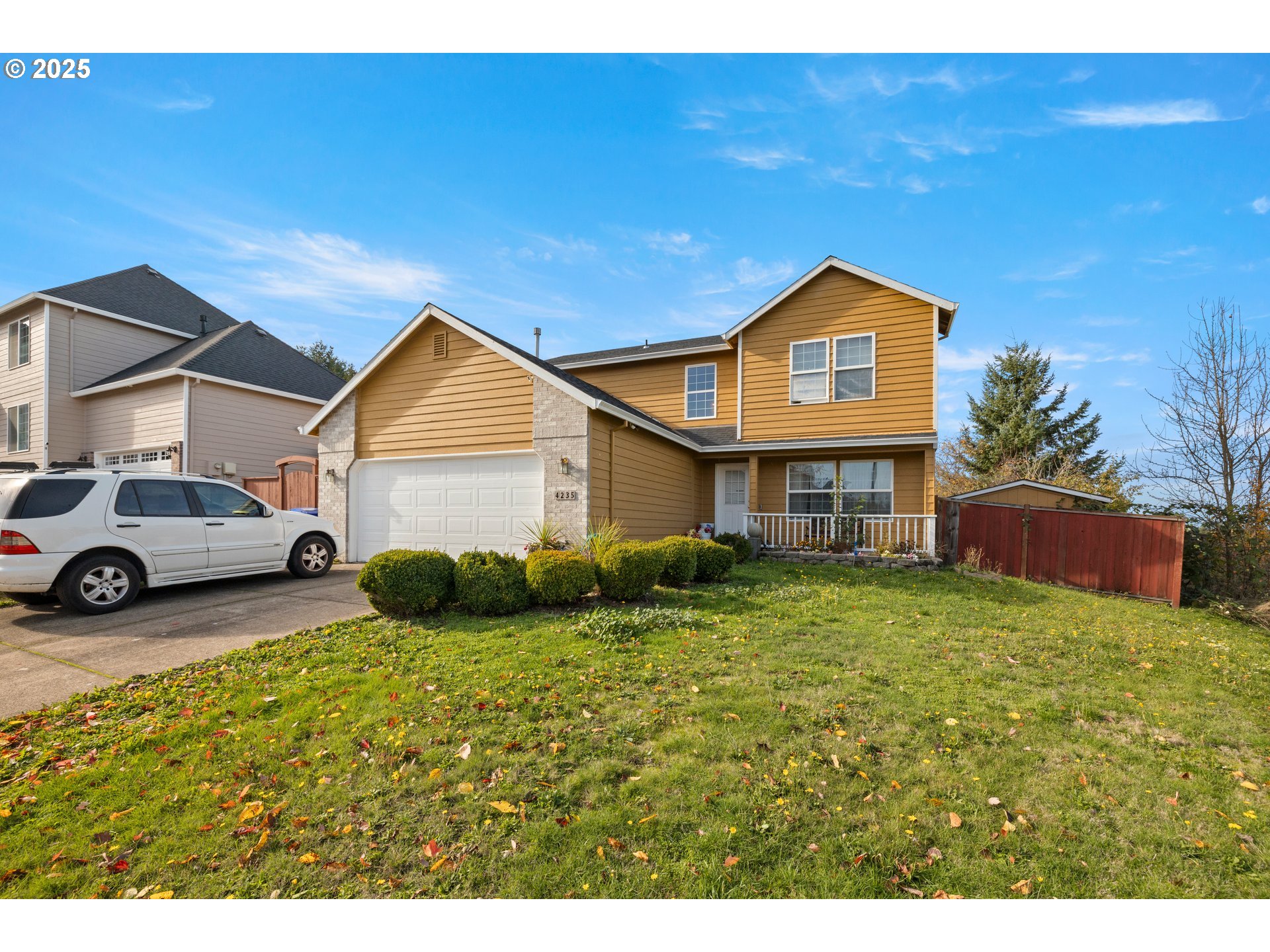 4235 Southeast Anderegg Loop Portland, OR 97236 - Photo 2 of 37 a view of a house with a big yard plants and large tree