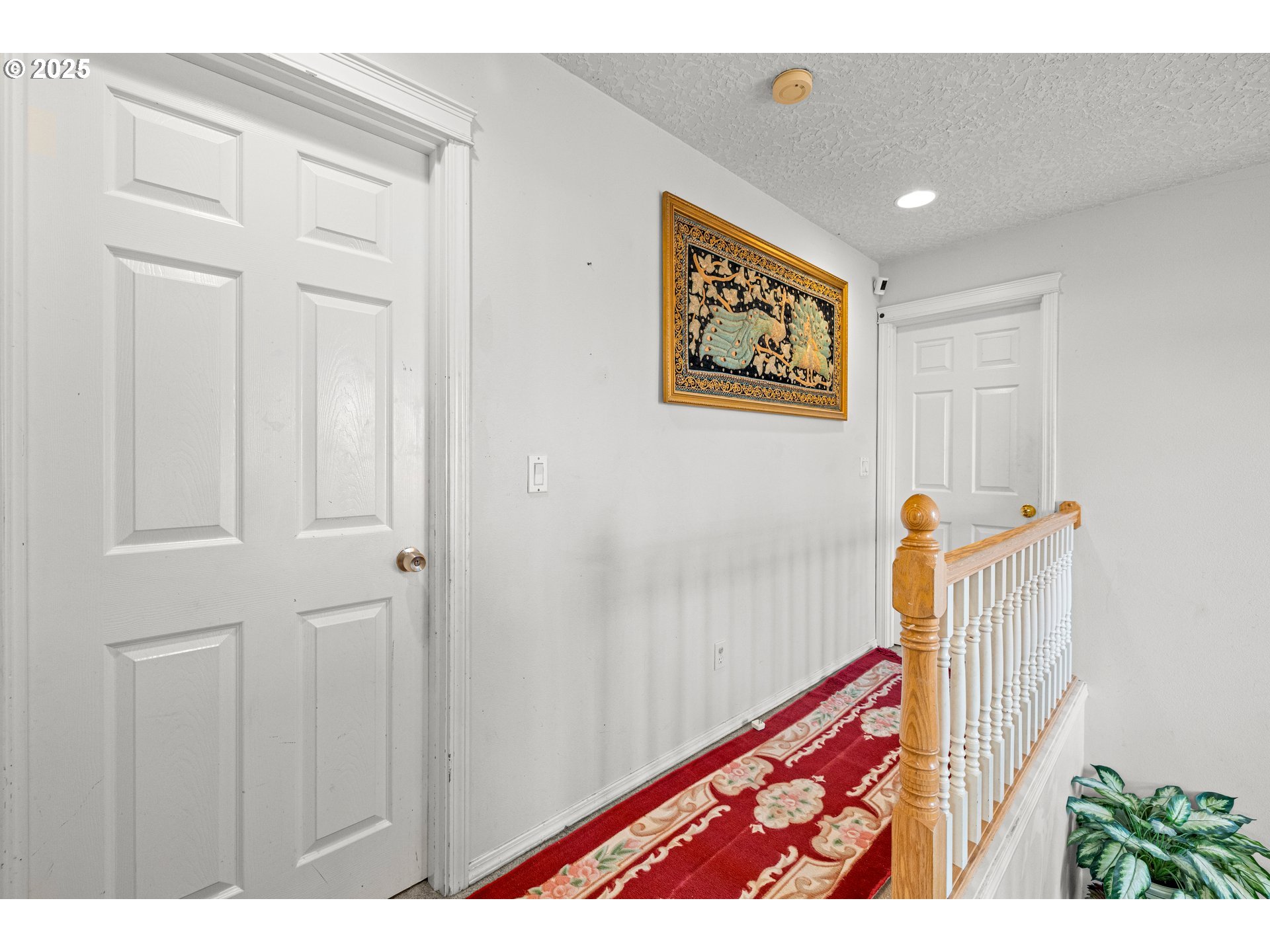 4235 Southeast Anderegg Loop Portland, OR 97236 - Photo 21 of 37 a view of a hallway with front door