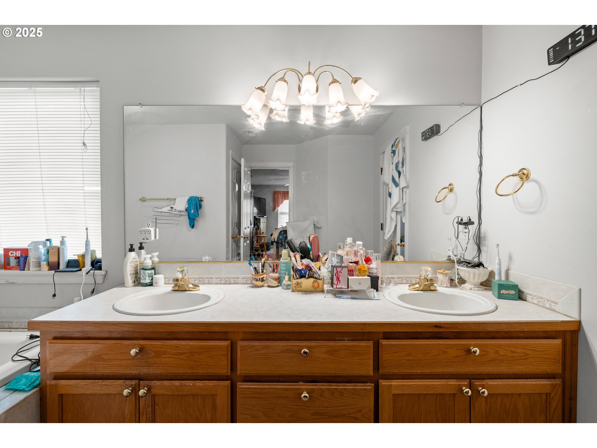 4235 Southeast Anderegg Loop Portland, OR 97236 - Photo 24 of 37 a bathroom with a sink double vanity and a mirror