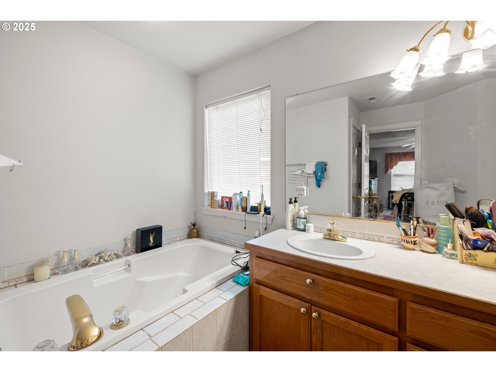 4235 Southeast Anderegg Loop Portland, OR 97236 - Photo 25 of 37 a bathroom with a sink and a mirror