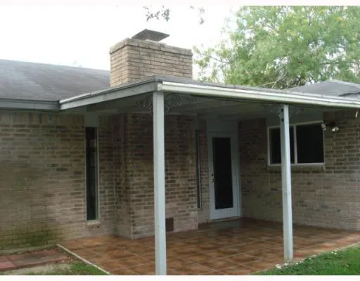 a front view of a house with a glass door