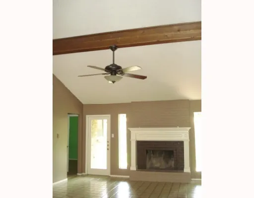a view of an empty room with a fireplace
