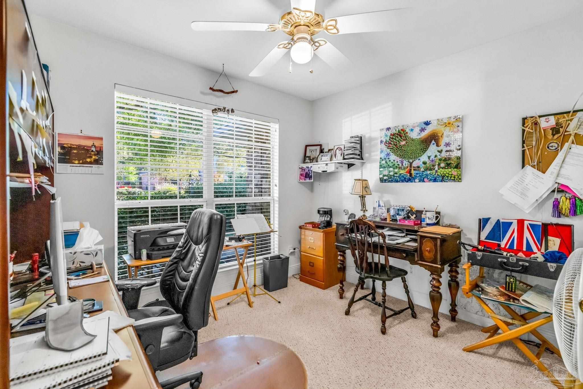 10149 Bittern Drive Pensacola, FL 32507 - Photo 28 of 56 a view of a workspace with furniture and a window