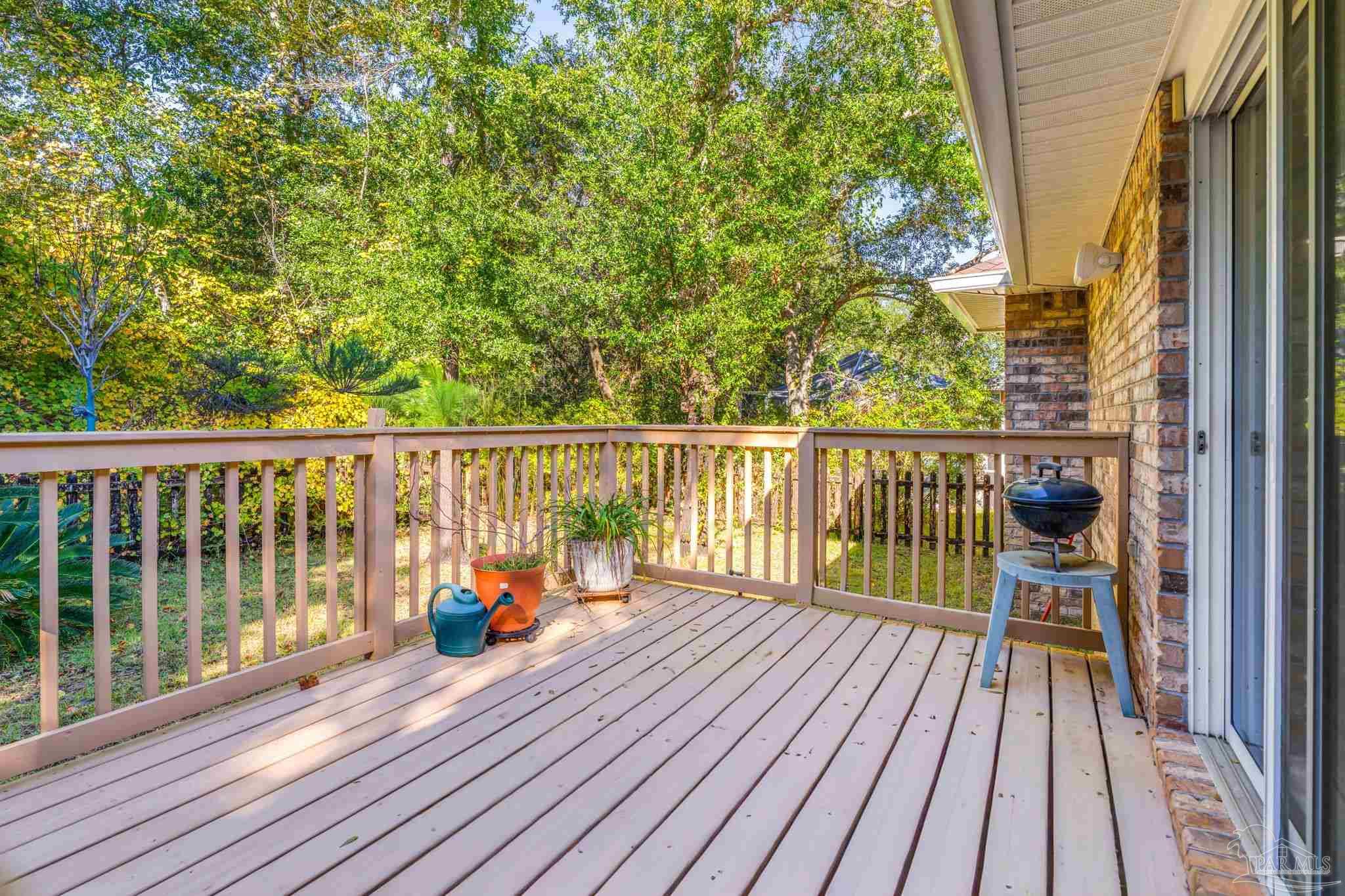 10149 Bittern Drive Pensacola, FL 32507 - Photo 37 of 56 a view of balcony with wooden floor and fence