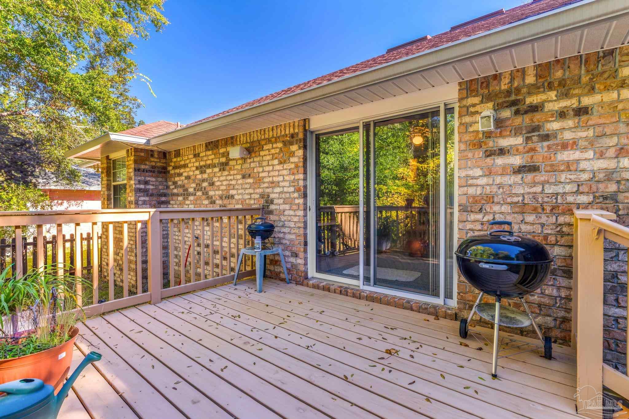 10149 Bittern Drive Pensacola, FL 32507 - Photo 38 of 56 a view of balcony with wooden floor and outdoor seating