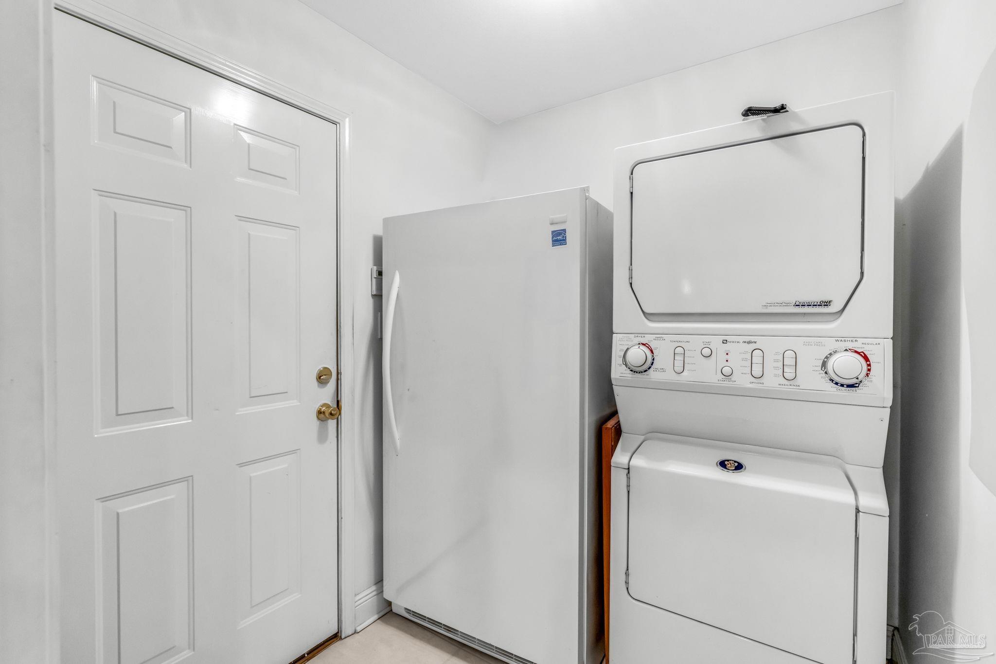 10149 Bittern Drive Pensacola, FL 32507 - Photo 41 of 56 a view of a storage and utility room with washer and dryer