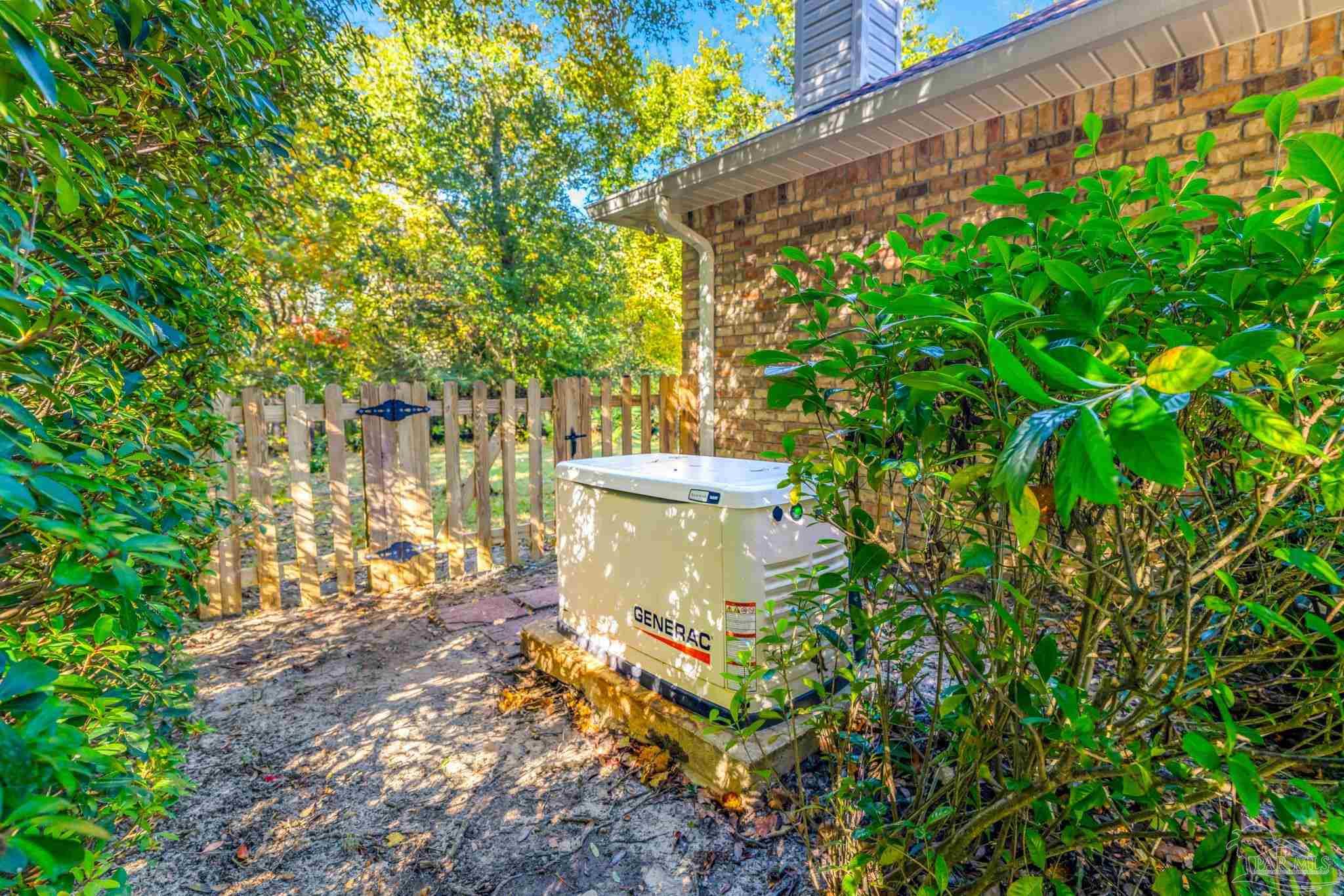 10149 Bittern Drive Pensacola, FL 32507 - Photo 43 of 56 a view of a yard with plants and large trees