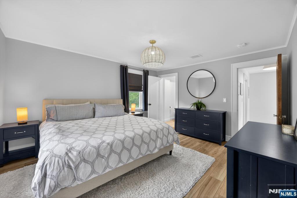 653 Ridgewood Avenue Bloomfield, NJ 07003 - Photo 11 of 27 a bedroom with a bed window and a table