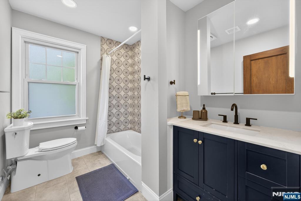 653 Ridgewood Avenue Bloomfield, NJ 07003 - Photo 15 of 27 a bathroom with a granite countertop sink toilet and shower