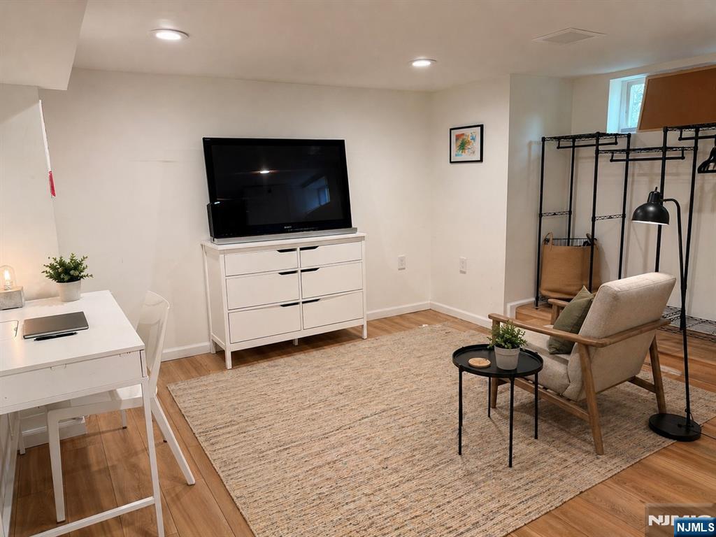 653 Ridgewood Avenue Bloomfield, NJ 07003 - Photo 18 of 27 a living room with furniture and a flat screen tv