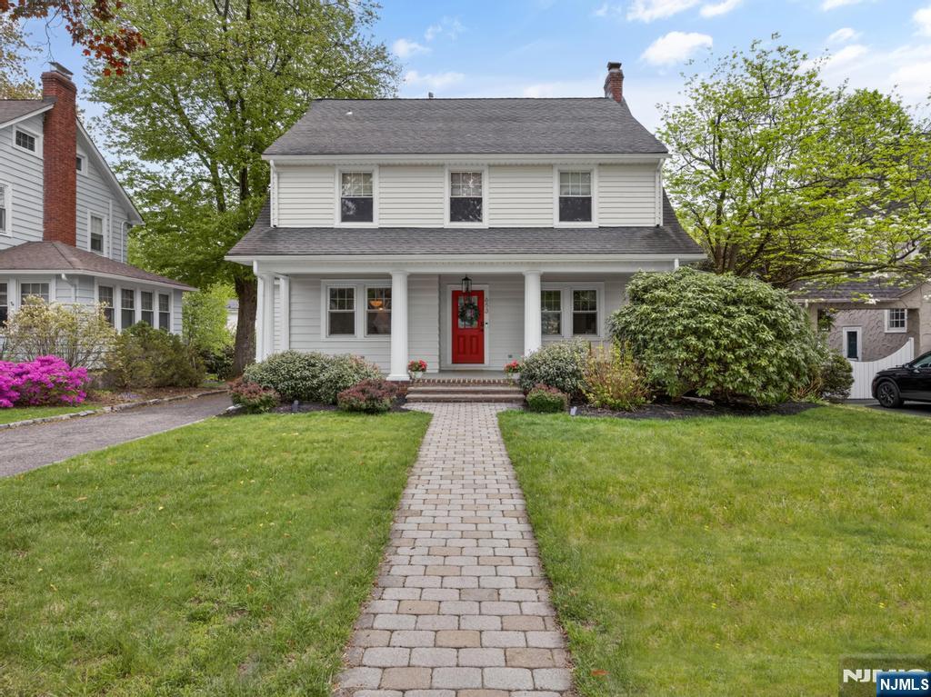 653 Ridgewood Avenue Bloomfield, NJ 07003 - Photo 2 of 27 a front view of a house with a yard