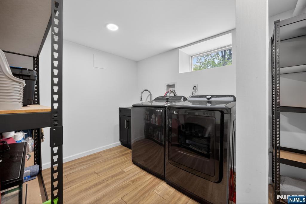 653 Ridgewood Avenue Bloomfield, NJ 07003 - Photo 22 of 27 a kitchen with a sink and cabinets
