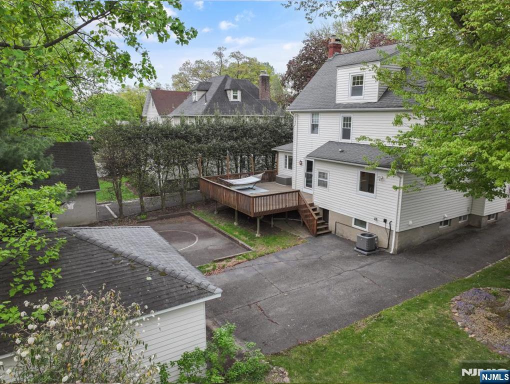 653 Ridgewood Avenue Bloomfield, NJ 07003 - Photo 24 of 27 a view of a house with a yard and sitting area