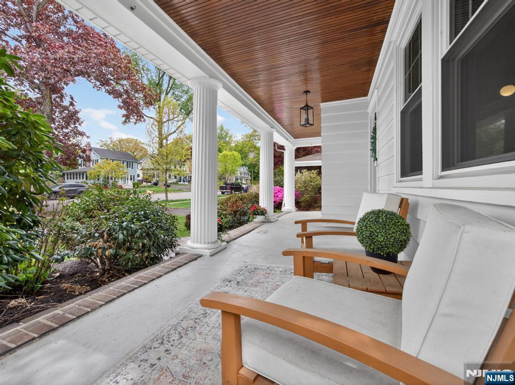 653 Ridgewood Avenue Bloomfield, NJ 07003 - Photo 3 of 27 a view of a patio with table and chairs and potted plants