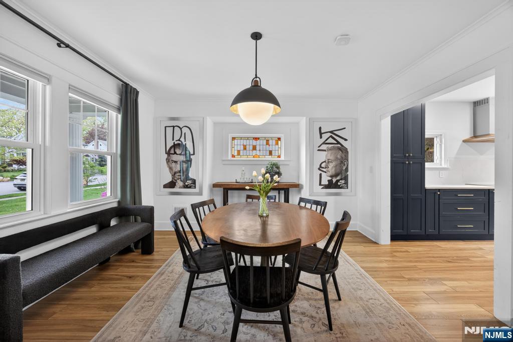653 Ridgewood Avenue Bloomfield, NJ 07003 - Photo 6 of 27 a view of a dining room with furniture window and wooden floor