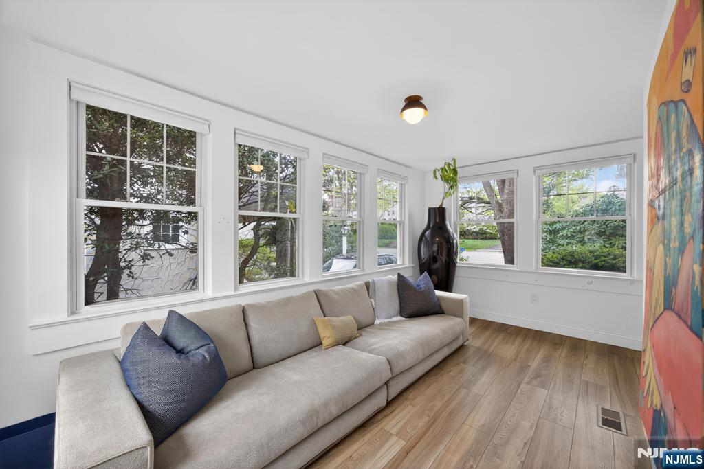 653 Ridgewood Avenue Bloomfield, NJ 07003 - Photo 10 of 27 a living room with furniture and a large window