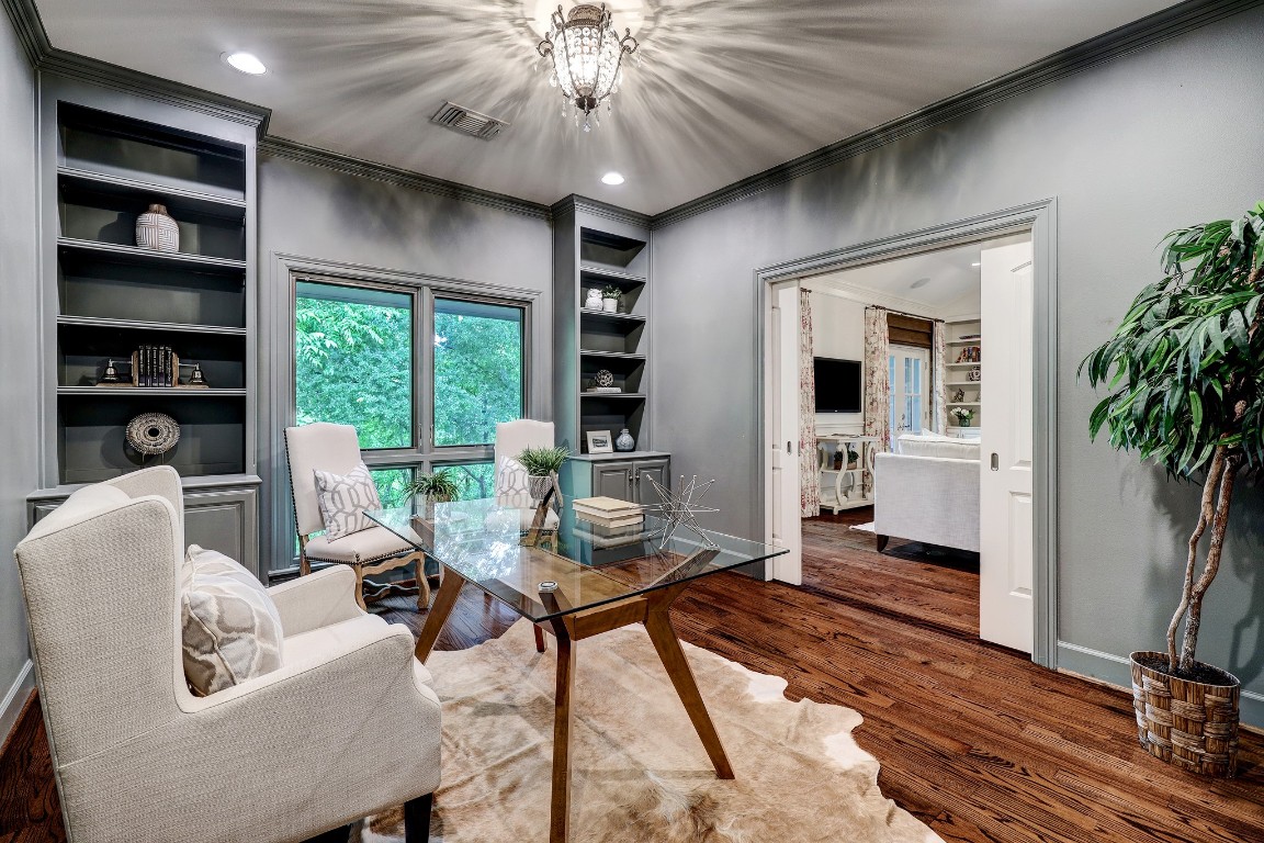 6599 Bayou Glen Road Houston, TX 77057 - Photo 12 of 41 You'll love having the home office or study that opens up to the family room. This space could also be a bedroom if needed. It can be closed off with the paneled pocket doors ands has access to the hall bath.