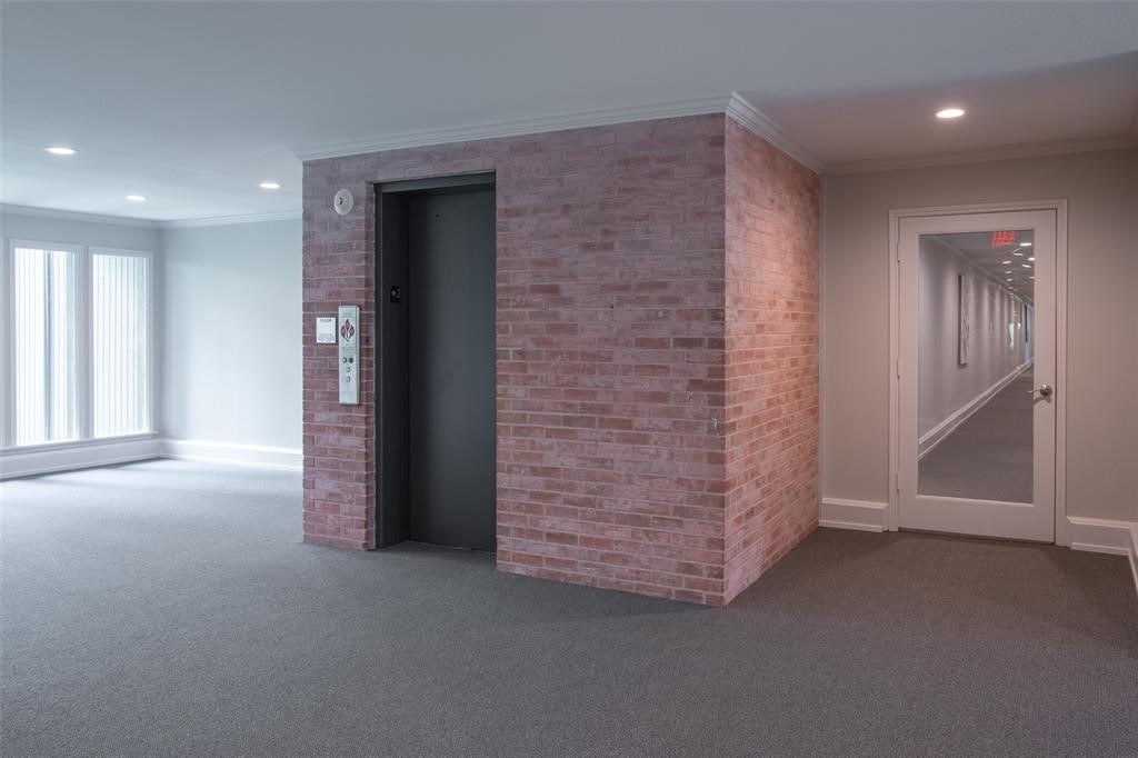 6599 Bayou Glen Road Houston, TX 77057 - Photo 38 of 41 The elevator takes you directly to the underground parking with two assigned parking spaces in a well lit garage.