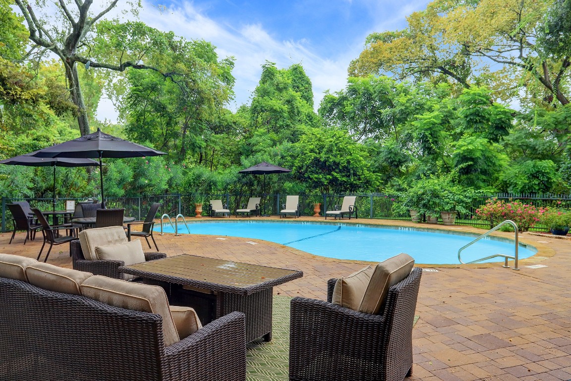 6599 Bayou Glen Road Houston, TX 77057 - Photo 39 of 41 The pool area is nestled in a serene setting with a sparkling pool, entertaining spaces and bar-be-que.