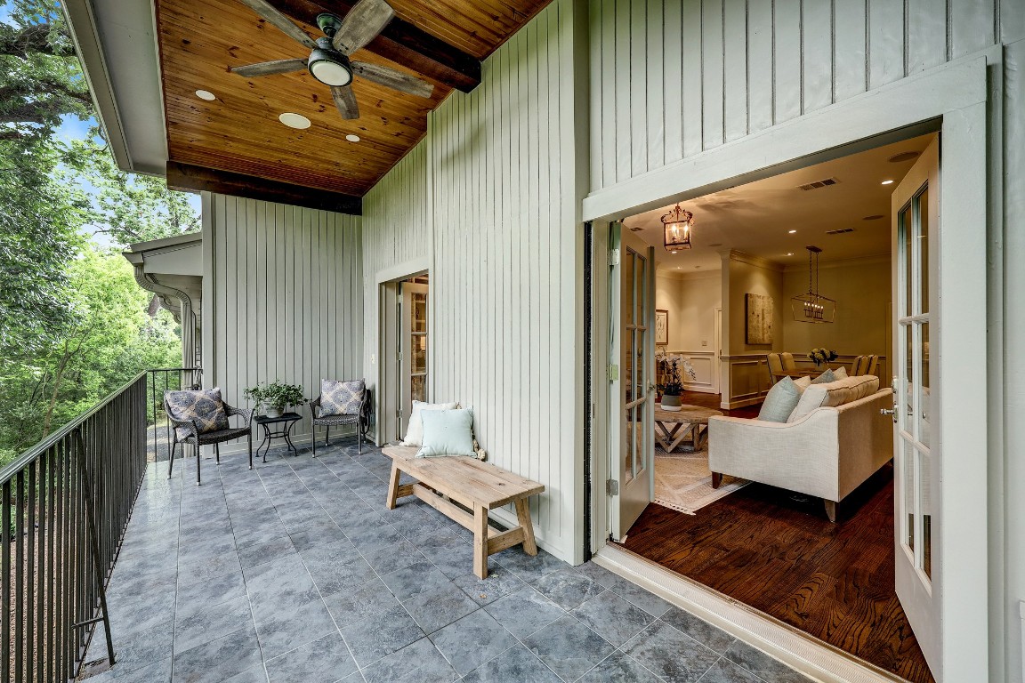 6599 Bayou Glen Road Houston, TX 77057 - Photo 8 of 41 The balcony is huge with soaring beadboard ceiling and ceiling fan. There is plenty of room for a patio table and chairs as well as an outdoor sitting area. Enhanced with the outdoor speakers and dimmable recessed lighting and you have fabulous outdoor living!
