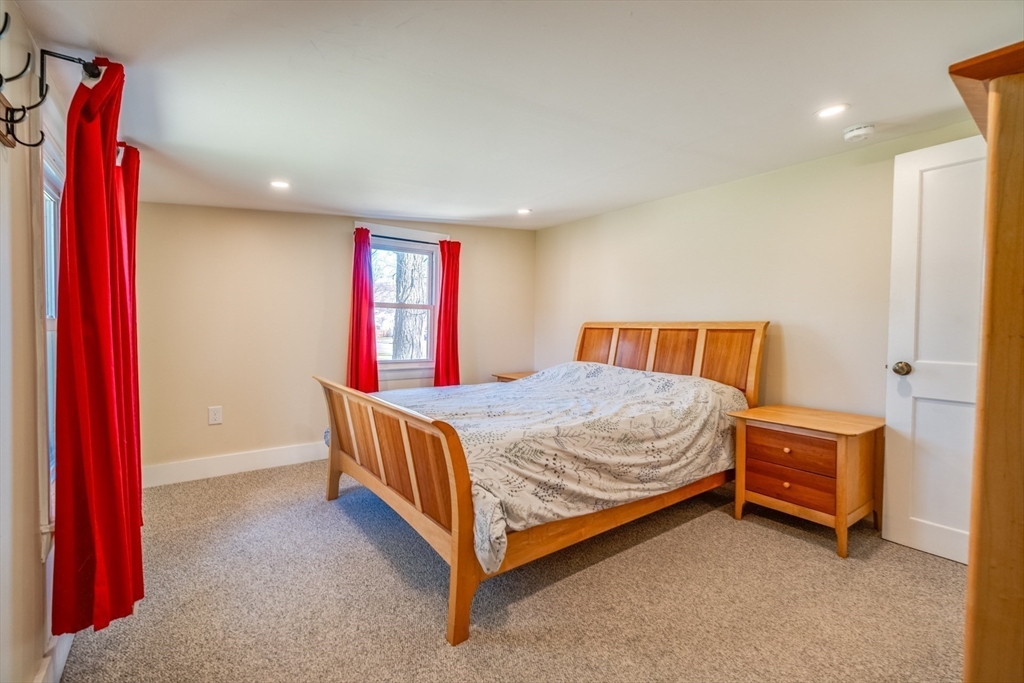 27 Bryan Avenue Easthampton, MA 01027 - Photo 24 of 39 a bed sitting in a room next to a window