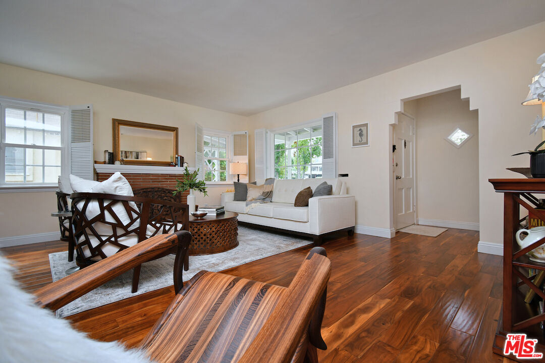 4226 Greenbush Avenue Sherman Oaks, CA 91423 - Photo 13 of 69 a bedroom with furniture and a wooden floor