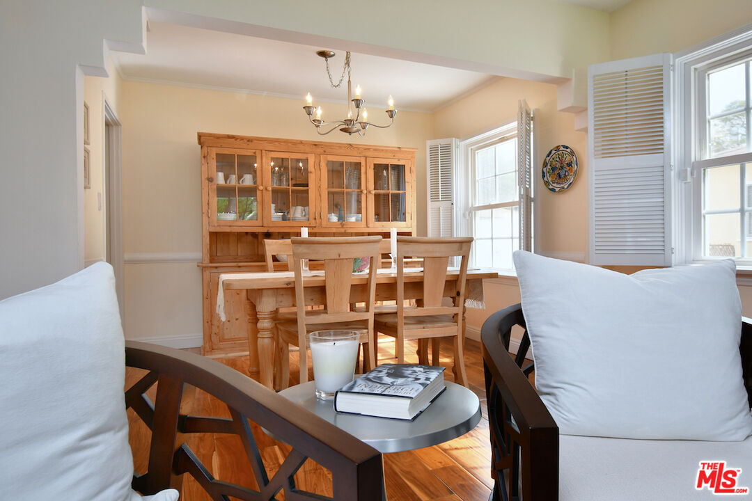 4226 Greenbush Avenue Sherman Oaks, CA 91423 - Photo 19 of 69 a view of a dining room with furniture and chandelier