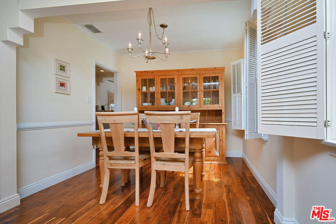 4226 Greenbush Avenue Sherman Oaks, CA 91423 - Photo 20 of 69 a view of a dining room with furniture window and wooden floor