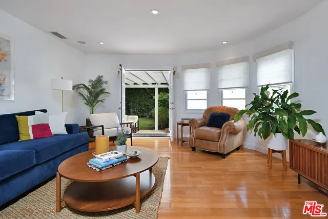 a kitchen with stainless steel appliances kitchen island granite countertop a refrigerator and stove