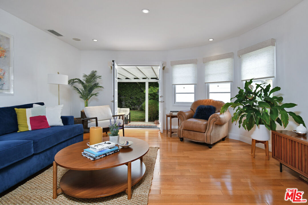 4226 Greenbush Avenue Sherman Oaks, CA 91423 - Photo 24 of 69 a living room with furniture potted plant and a large window